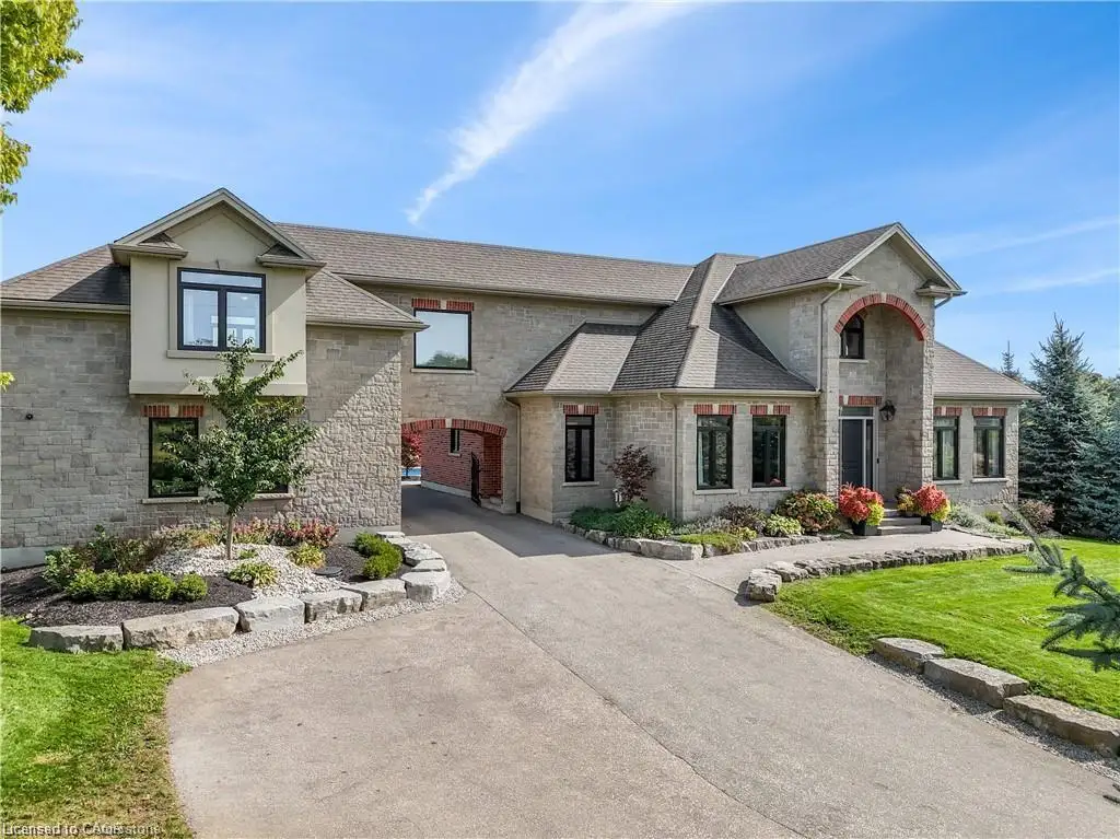 View of front of home featuring a carport and a front yard