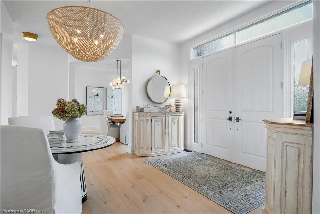 Entryway featuring a notable chandelier and light wood-type flooring