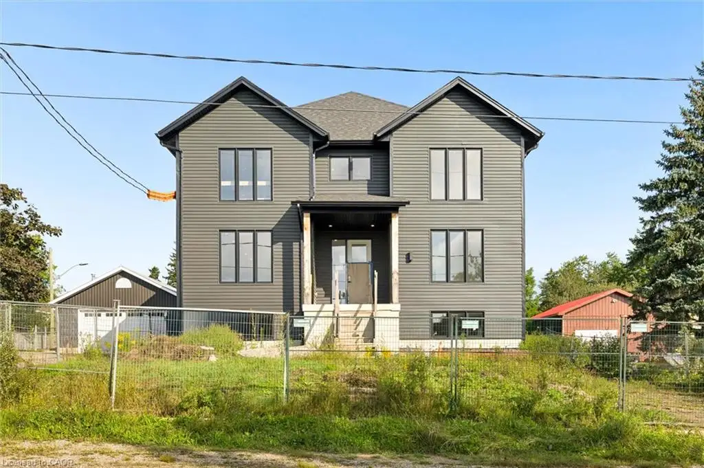Modern exterior featuring dark gray horizontal siding and black-framed windows