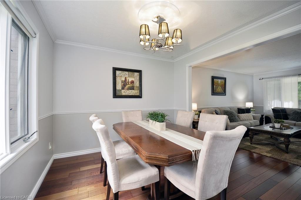 Hardwood-finish flooring, crown molding, and two-tone wall treatment