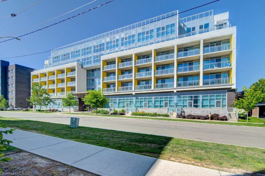 Modern multi-story building featuring a distinctive facade with yellow-accented balconies