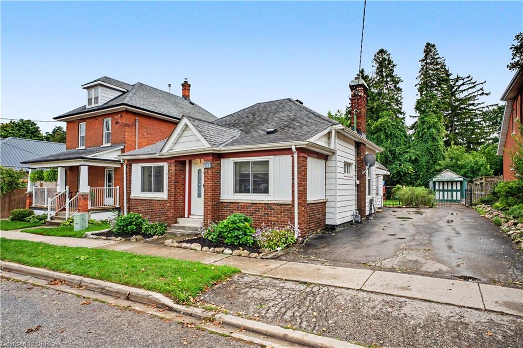 Brick exterior with white siding accents