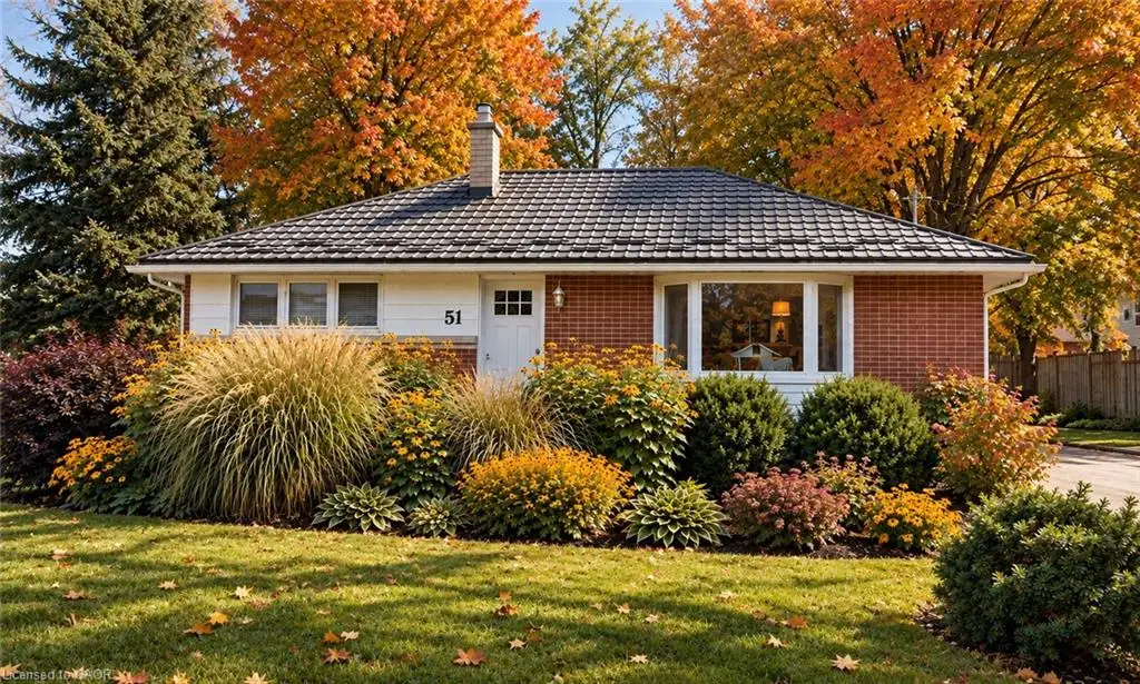 Brick and siding exterior with a dark-toned roof