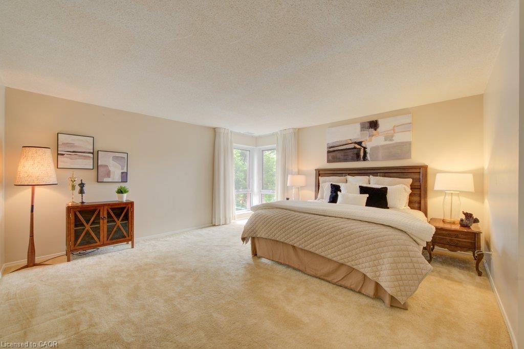 2- Expansive room featuring wall-to-wall carpeting and neutral wall tones