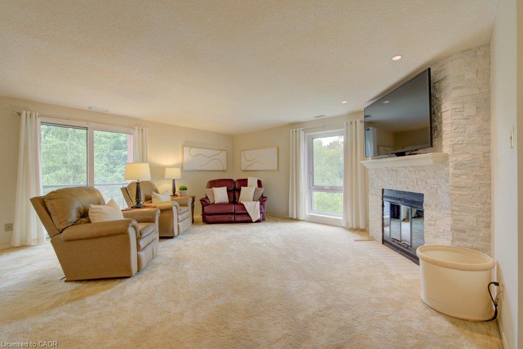 3- Spacious living room with a plush carpet and neutral paint finishes throughout