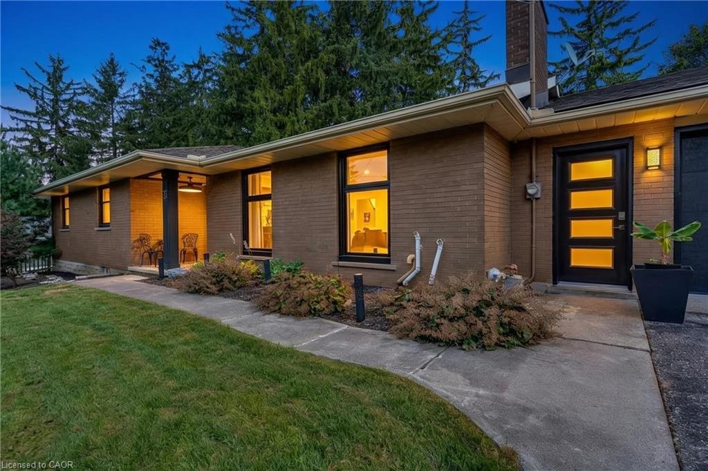 Brick exterior featuring a covered porch with recessed lighting