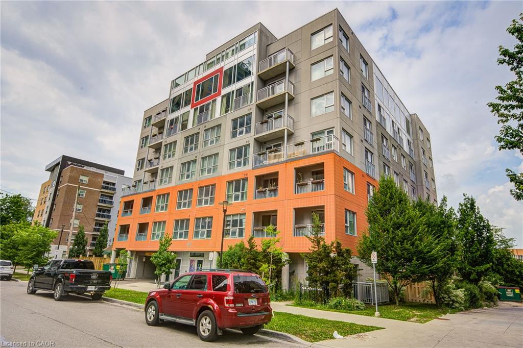 Modern multi-story building featuring a distinctive orange and gray facade