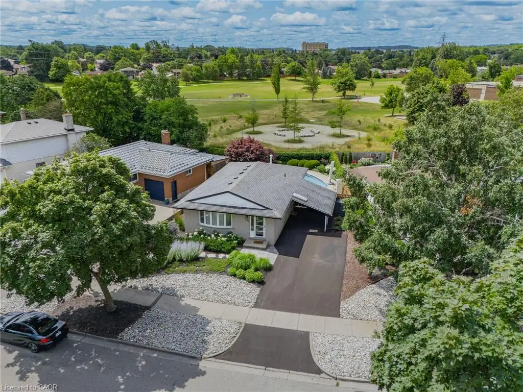 Backs to Parkland with NO rear neighbours!  Inground heated pool has fully-landscaped, fenced yard with no grass to maintain!  Power awning with rain sensors provides shade on hot days, and great concrete patio.