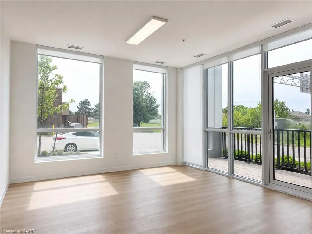 Expansive room featuring light wood-finish flooring