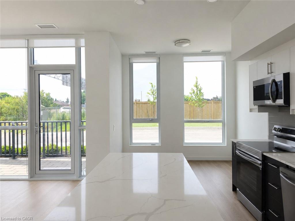 Kitchen island featuring a white countertop with subtle veining