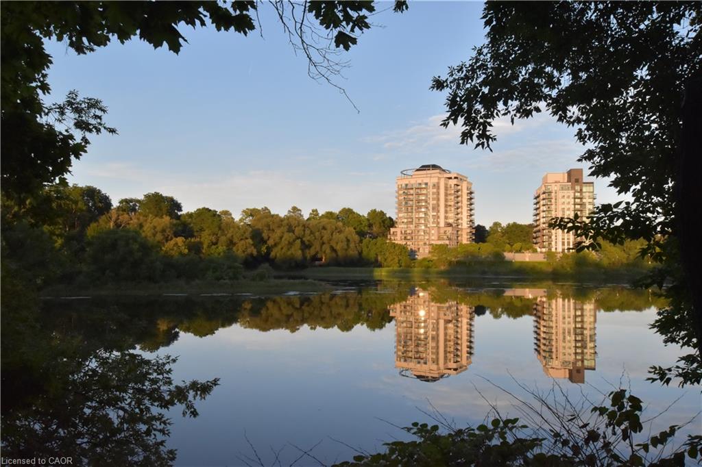 Waterfront setting with direct water frontage, offering serene water reflections and a verdant treeline