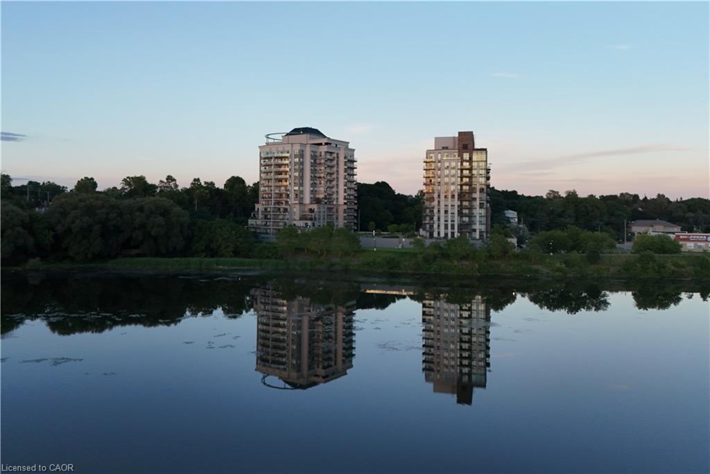 Waterfront high-rise residences featuring private balconies and reflective water frontage