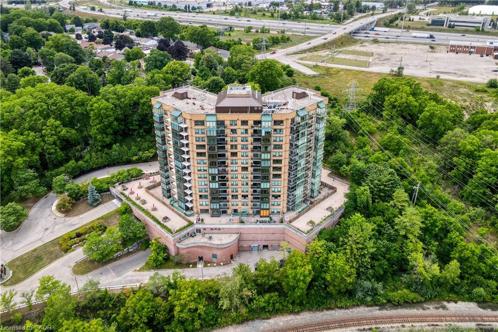 Multi-story building featuring numerous balconies and a flat roof