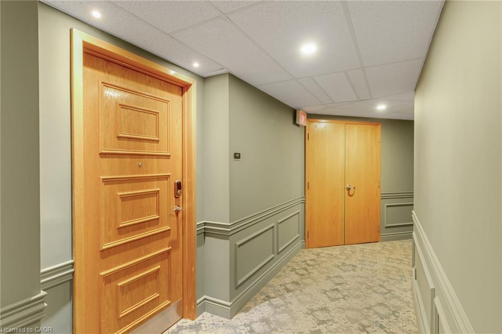 Recessed lighting, applied wall molding, paneled doors, and patterned carpeting