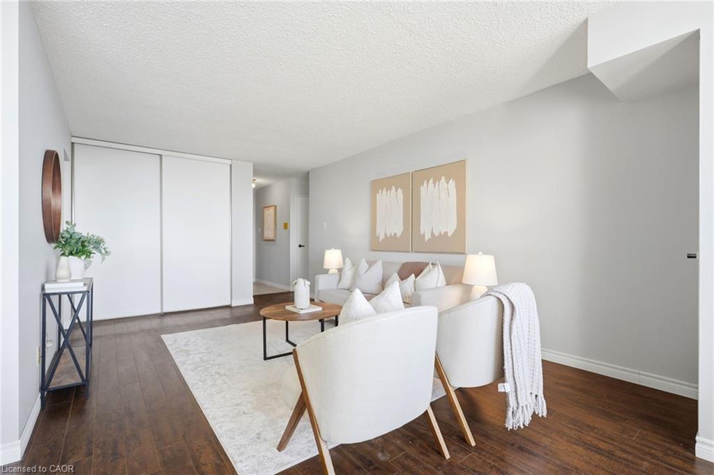 Dark wood-finish flooring complements the light wall tones