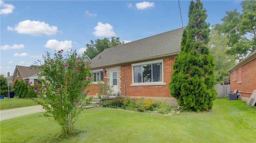 Brick exterior with a gabled roof and white trim