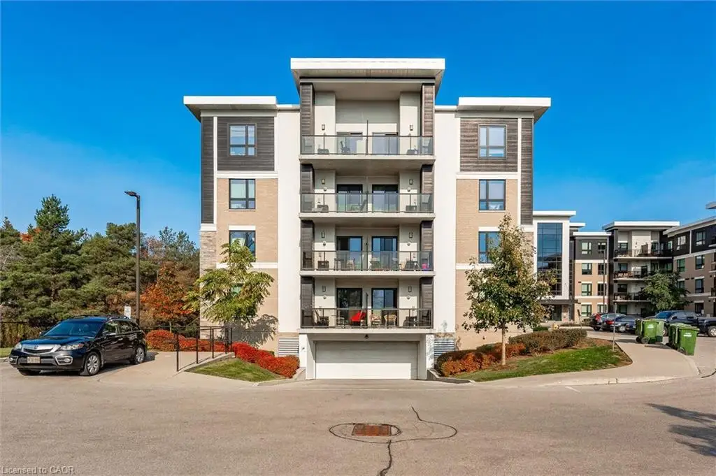 View of apartment building / complex with an attached garage