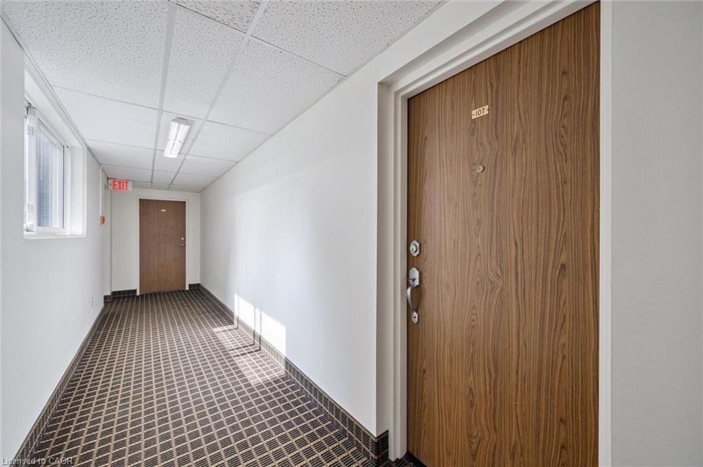 Wood-finish entry door with multiple locks and a peep-hole