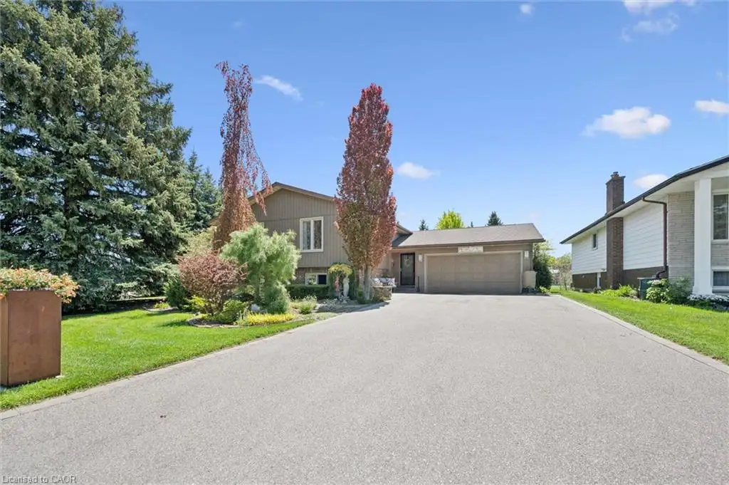 Paved driveway leading to an attached garage