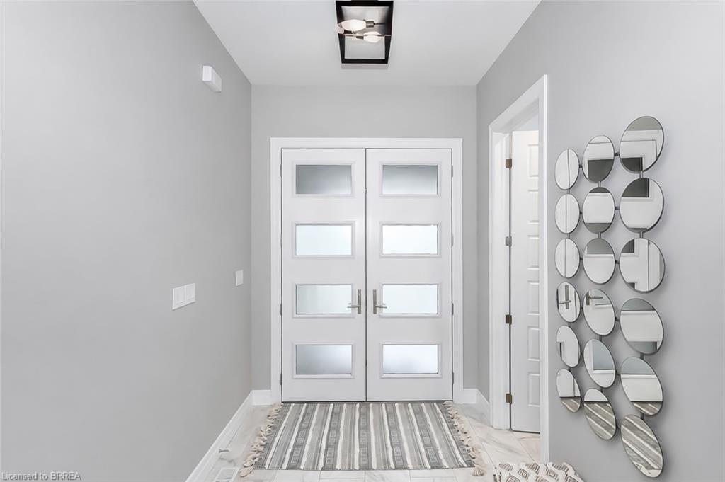 Double entry doors featuring frosted glass panels