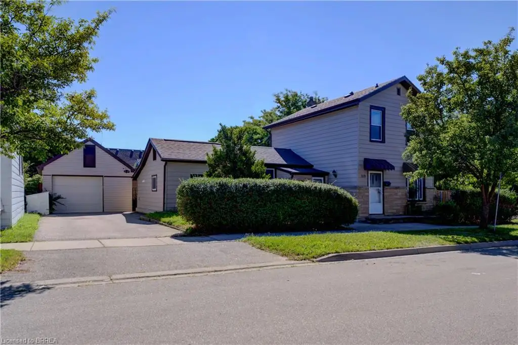 Two separate living spaces with 4 entrances! Potential for multi generational family living or income. Big driveway, detached garage