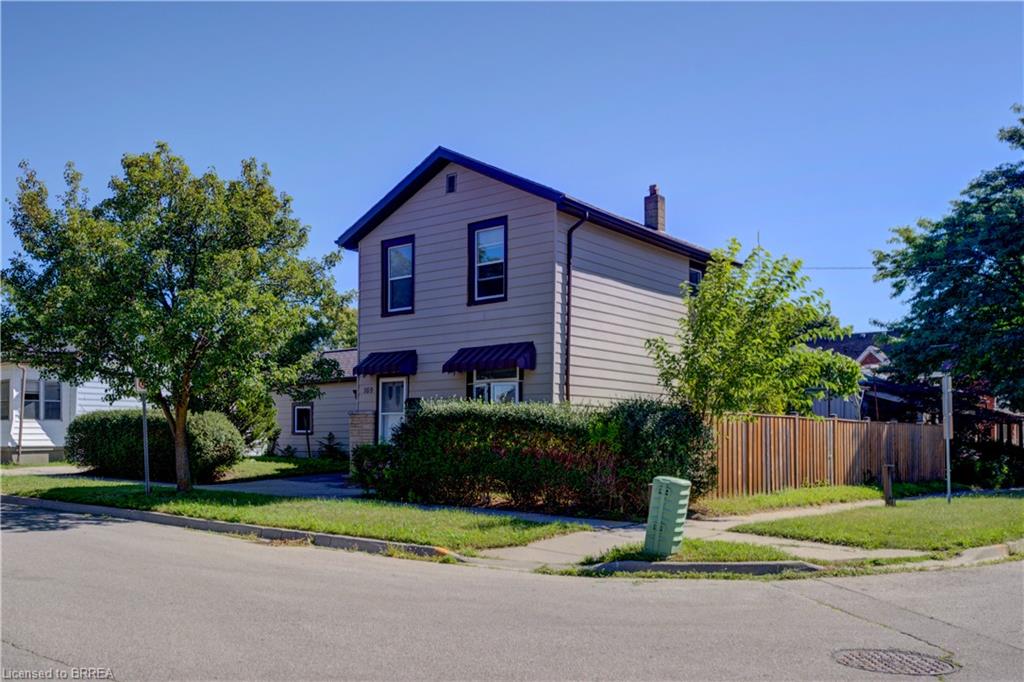 Sideview of home. Yard completely fenced in. Superb location.