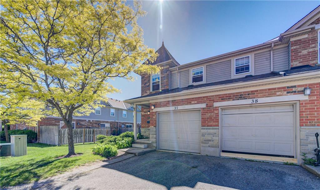Brick and stone façade with siding accents, offering a two-car garage