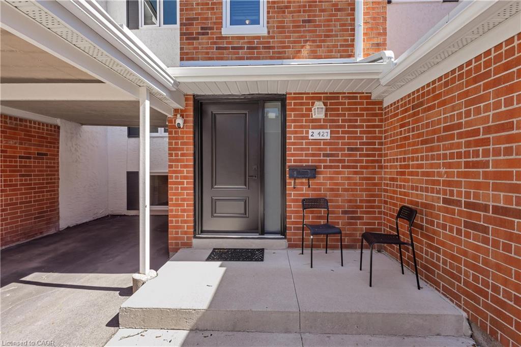 Brick facade with a covered carport