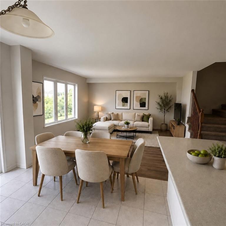 Open-concept living space with a dining area, tile flooring, and wood-finish flooring