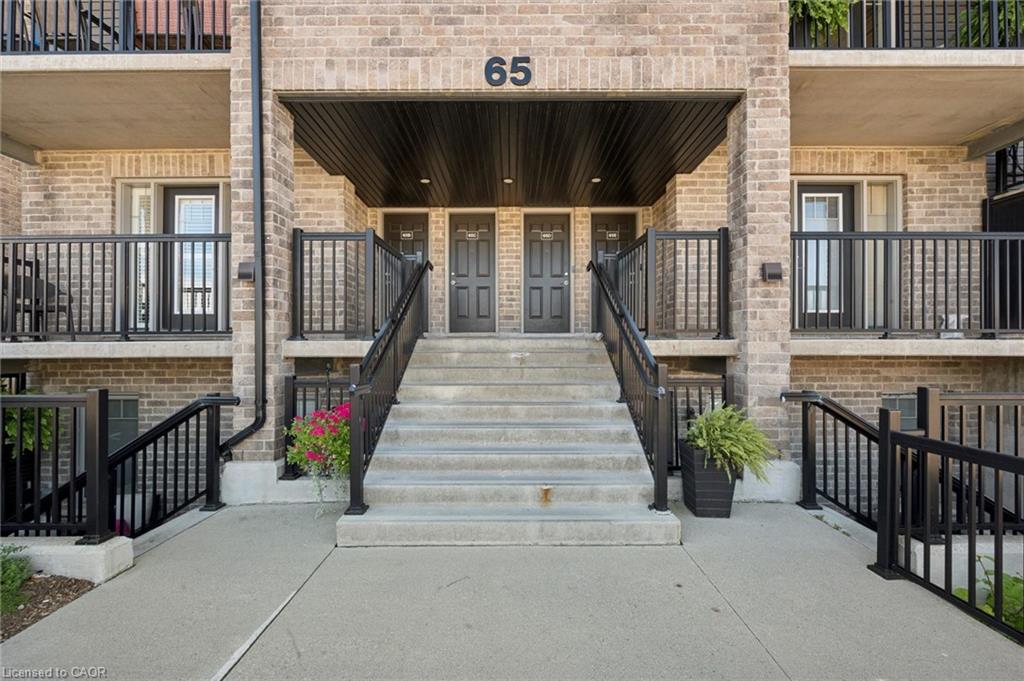 Brick exterior with multiple balconies and black railings