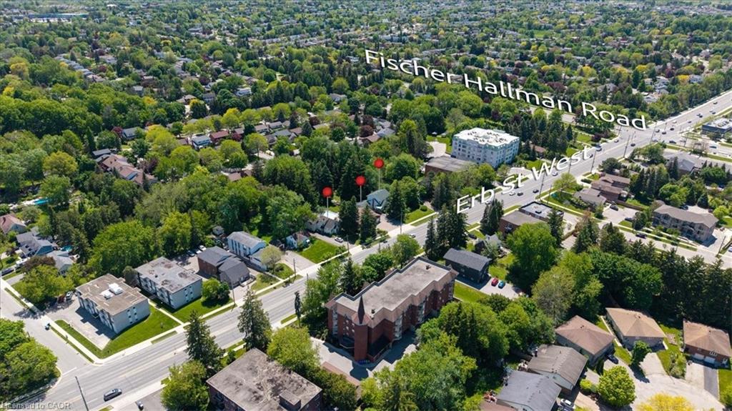 Aerial perspective of a residential area featuring mature trees and established properties