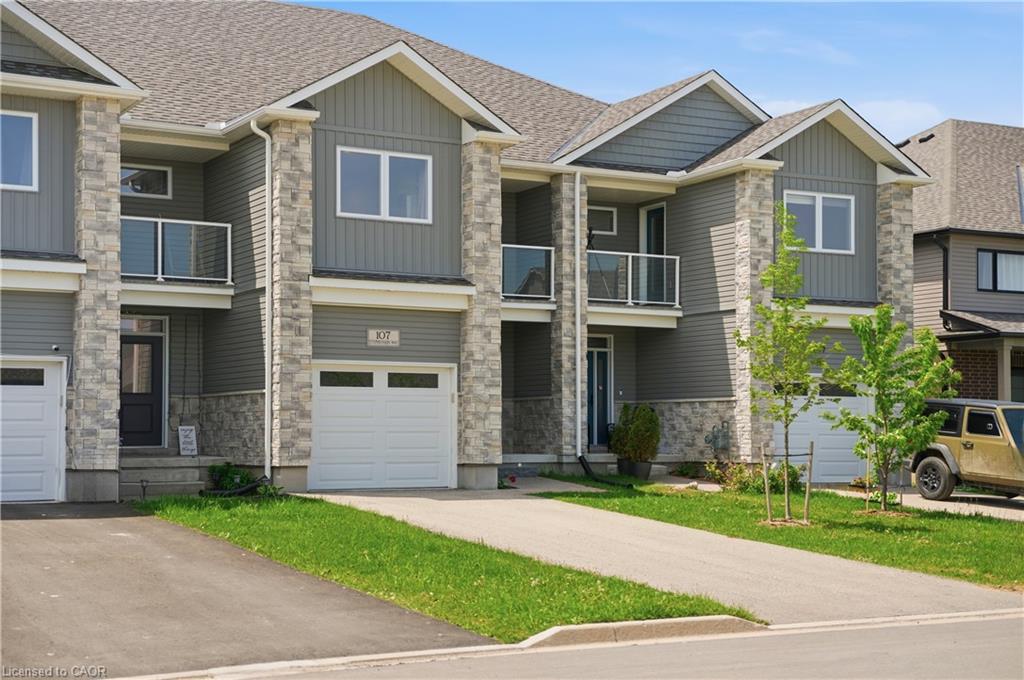 Contemporary townhome featuring stone and siding facade