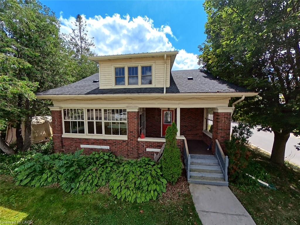 Brick exterior with painted wood siding accents