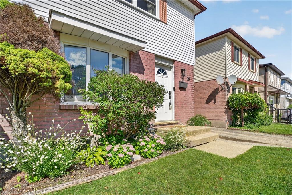 Brick and siding exterior with a prominent bay window