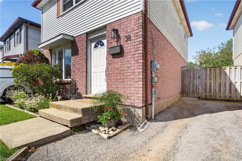 Brick exterior with white siding accents and a front porch