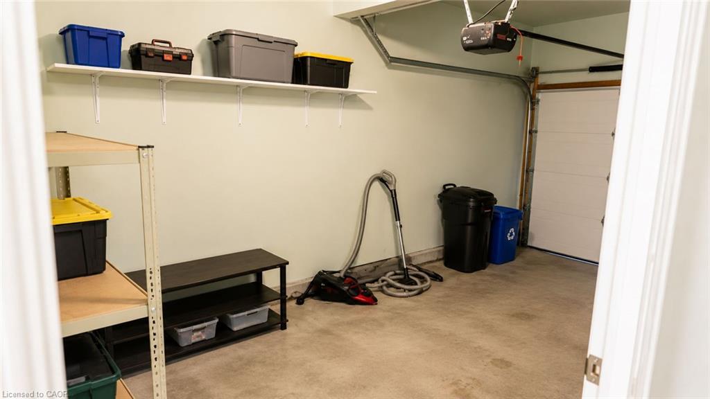 Attached garage with a sectional overhead door and an automatic opener