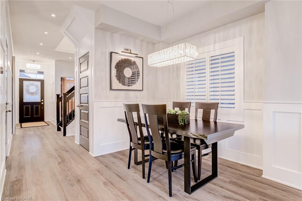 Dining room featuring light wood finished floors and recessed lighting