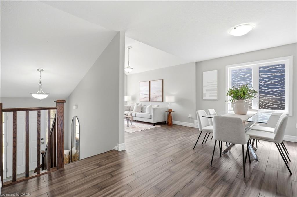 Wood-finish flooring throughout, light gray wall tones, and white trim
