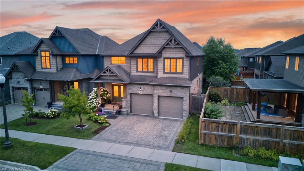 Stone and siding exterior with gabled roof lines