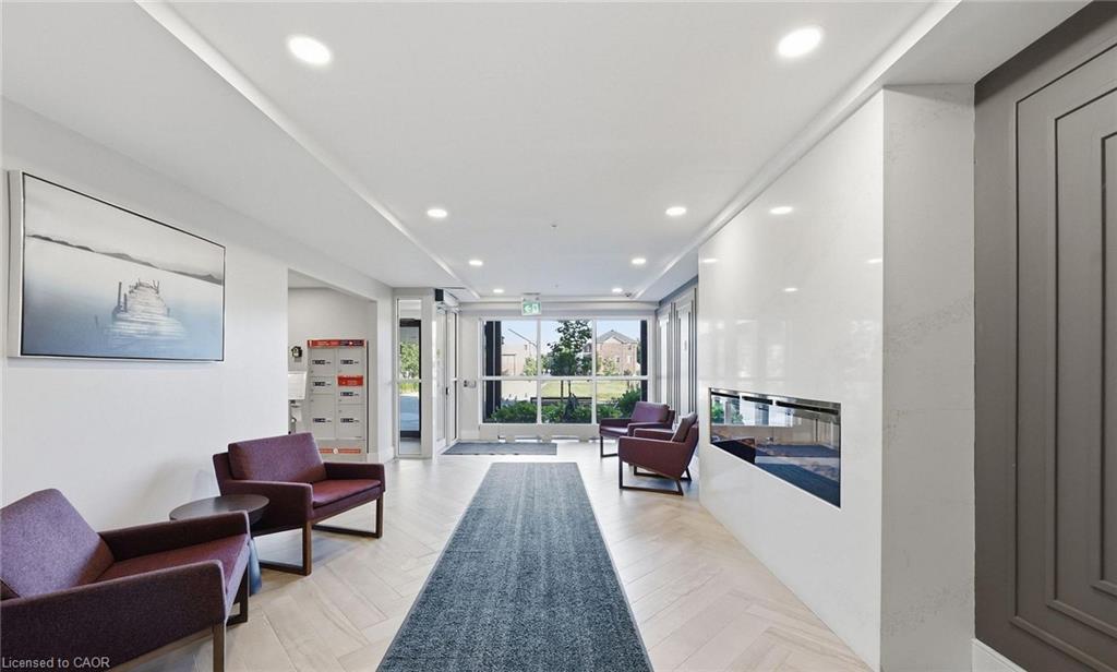 Recessed lighting, wood-finish flooring, and an integrated linear fireplace