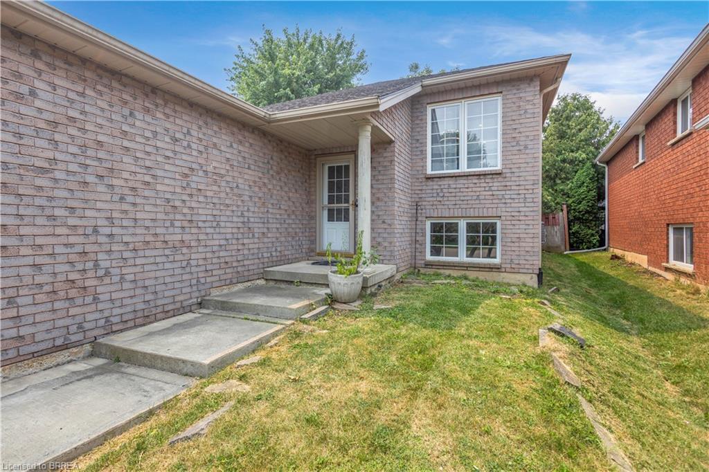 Brick exterior with a covered front porch entry