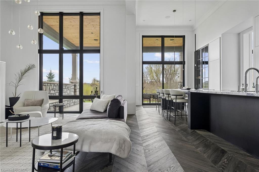 Open-concept living space featuring high ceilings and expansive windows