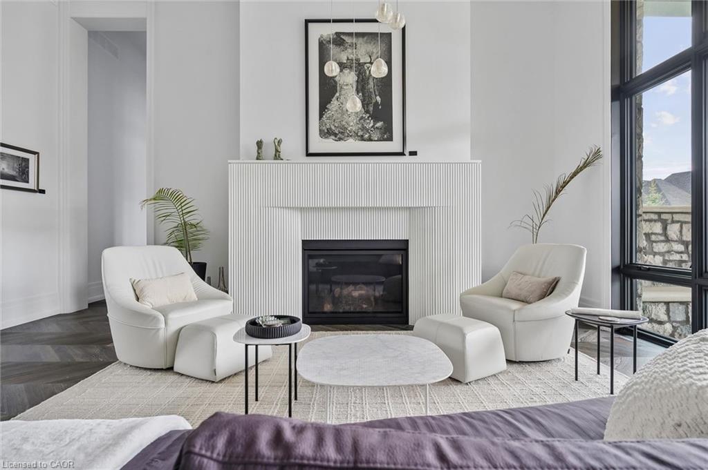 Living area with a contemporary fireplace featuring a fluted white surround and a black firebox