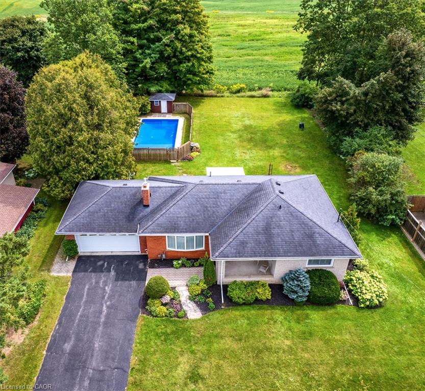 This 3 bedroom, 2 bathroom bungalow sits on an almost 1/2 acre of property and includes a in-ground saltwater pool!