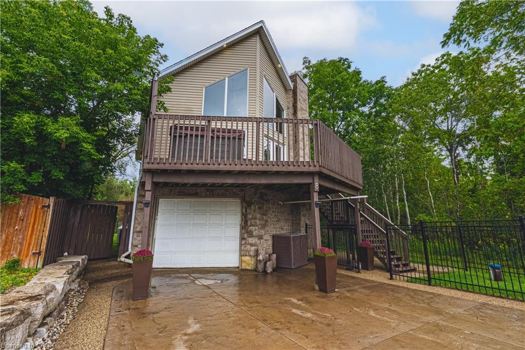 Raised architectural design with stone and siding exterior