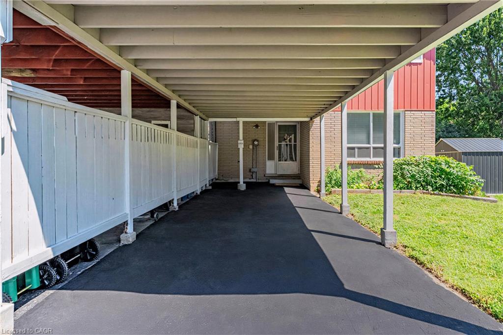 Carport providing extremely convenient sheltering from snow, rain, and sun.