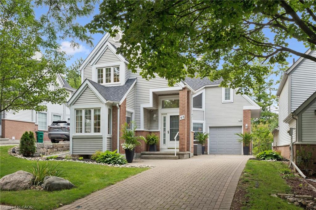 Brick and siding exterior with a gabled roofline