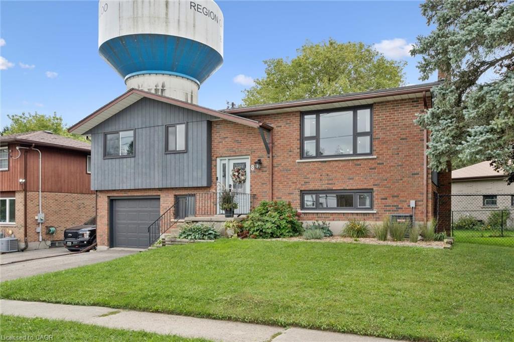 Brick and siding exterior with mature landscaping
