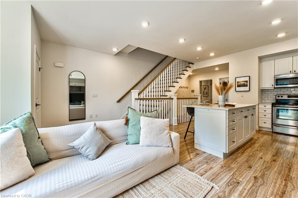 Open concept living allows a natural flow from the kitchen into the living space with pot lights, hardwood flooring, storage closets and a charming Juliette balcony with french sliding doors.