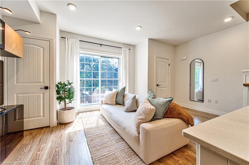 Open concept living allows a natural flow from the kitchen into the living space with pot lights, hardwood flooring, storage closets and a charming Juliette balcony with french sliding doors.